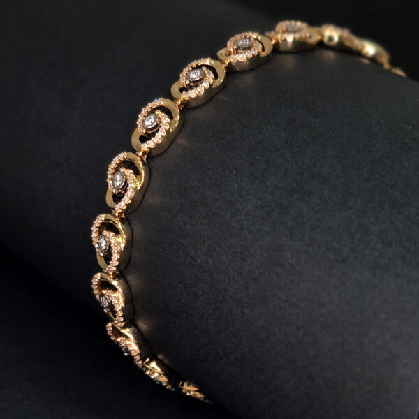 A flowing spiral design that draws the eye outward from a central diamond, creating movement and brilliance with every turn.