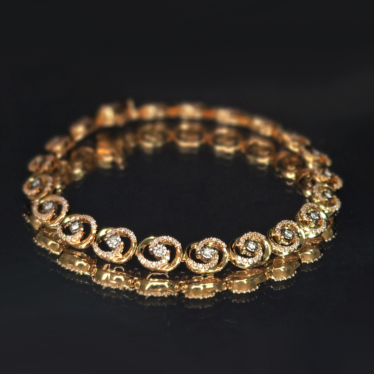 A flowing spiral design that draws the eye outward from a central diamond, creating movement and brilliance with every turn.