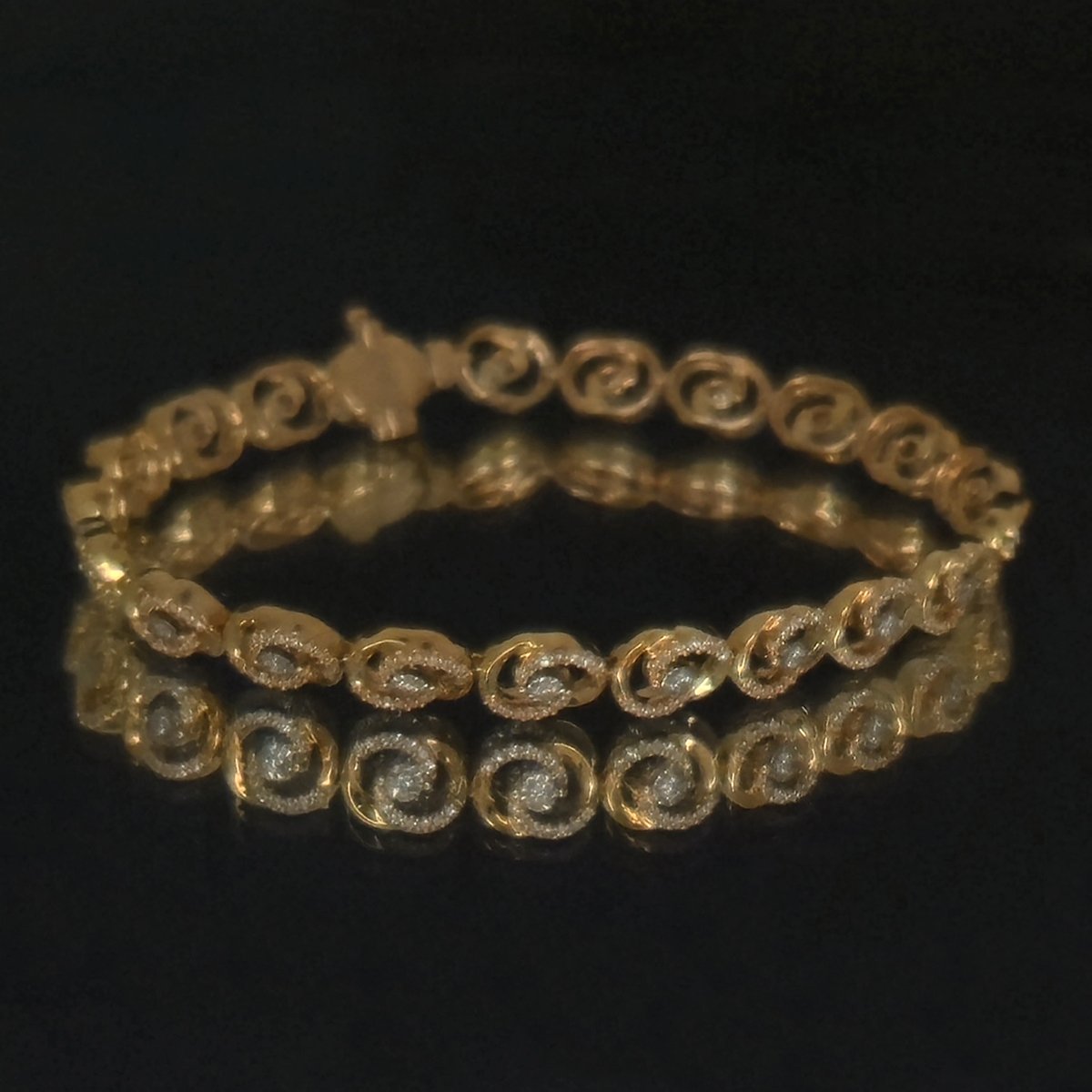 A flowing spiral design that draws the eye outward from a central diamond, creating movement and brilliance with every turn.