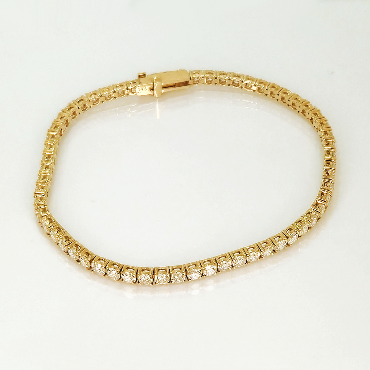 A classic warm design that brings together the brilliance of diamonds set against warm gold the catches the light from every angle.