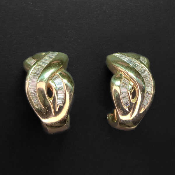 Stylish yellow gold figure eight earrings set with diamonds
