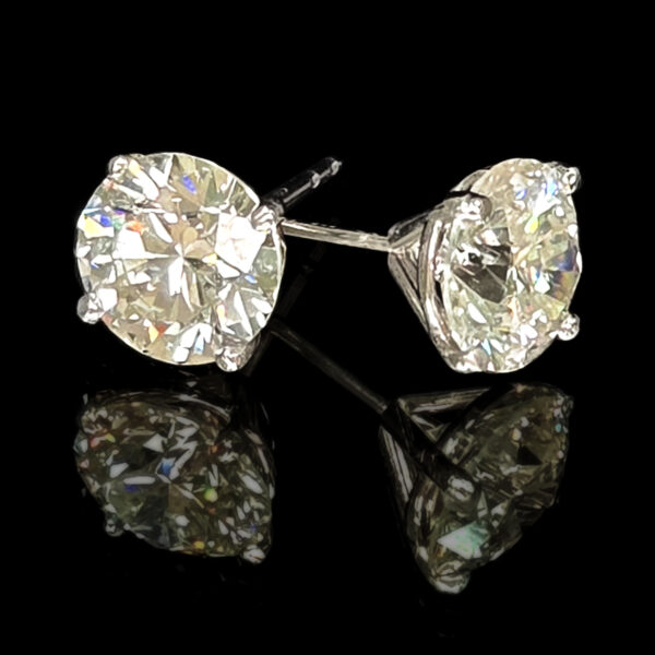 A pair of brilliant white, lab-grown diamond stud earrings set in 14K white gold