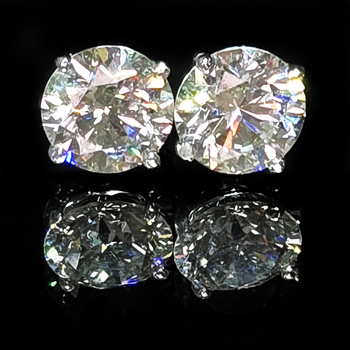 A pair of brilliant white, lab-grown diamond stud earrings set in 14K white gold