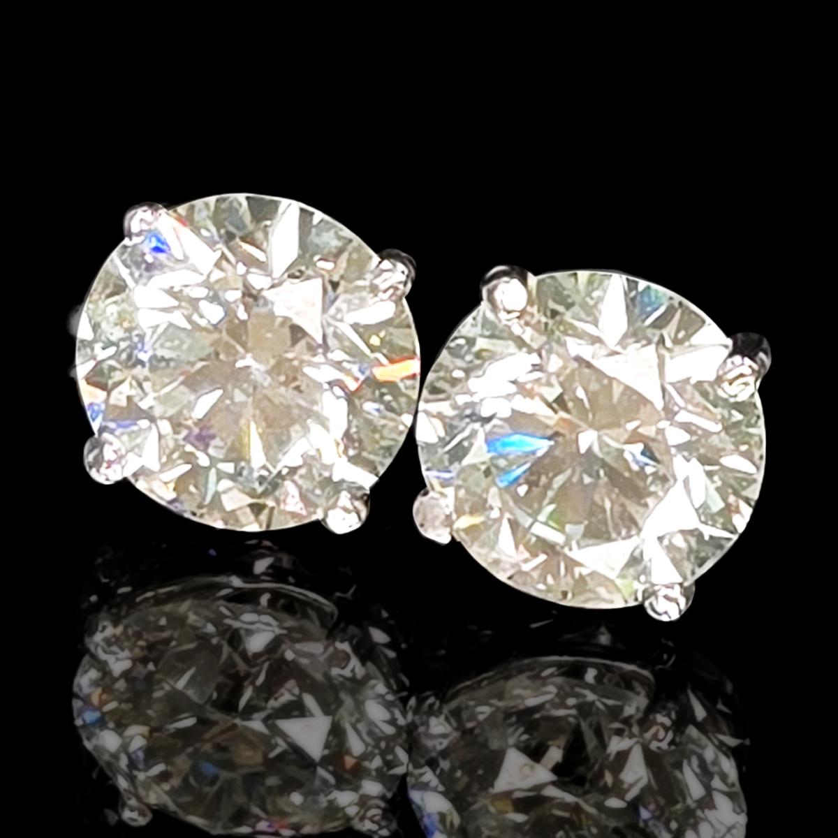 A pair of brilliant white, lab-grown diamond stud earrings set in 14K white gold