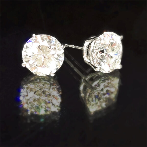 A pair of brilliant white, lab-grown diamond stud earrings set in 14K white gold