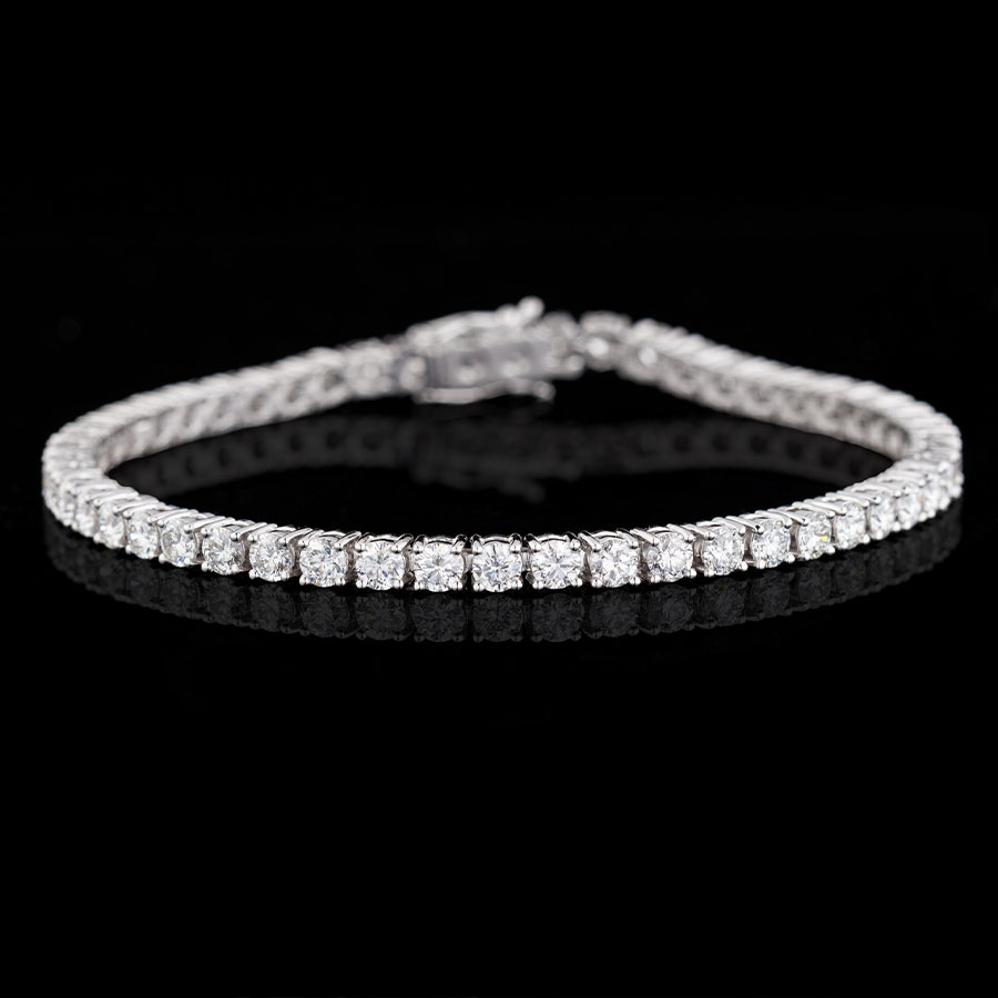 Bracelets a tennis bracelet with brilliant white diamonds on a black background