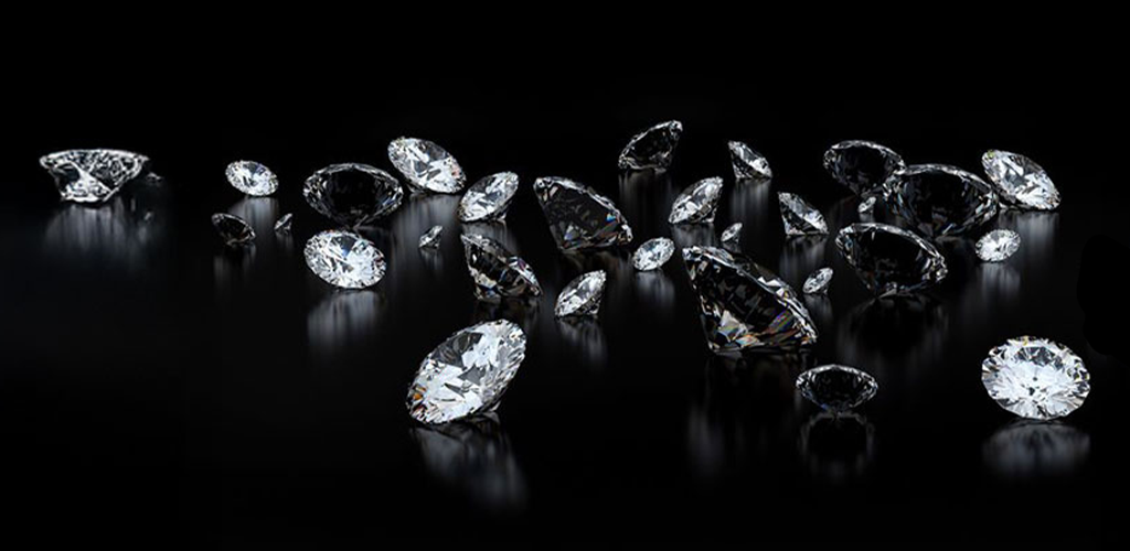 scattered white diamonds on a black background with slight light reflection