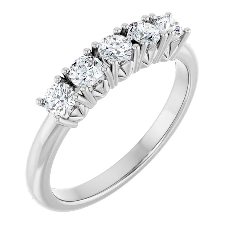 elegant diamond wedding band with five stones showing